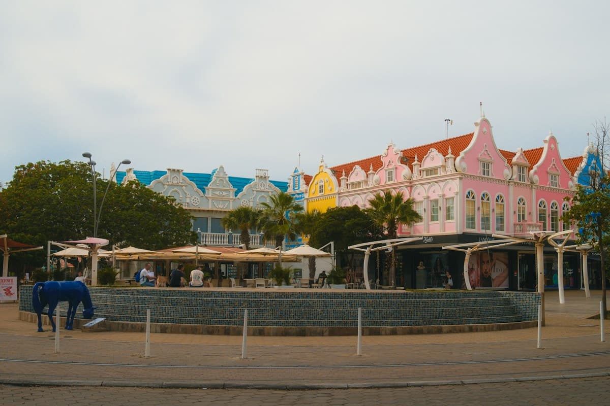 Colourful commercial buildings and a public plaza in Aruba.