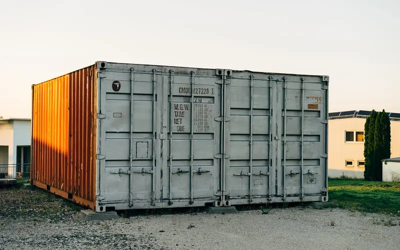 Closed shipping-container doors at a storage facility.
