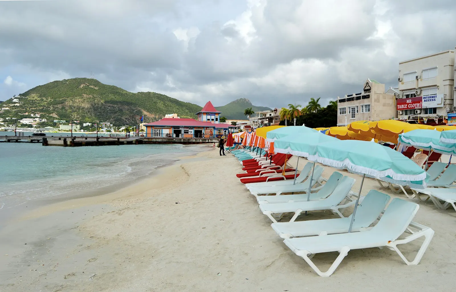 Beach chairs, waterfront buildings and a pier at Great Bay in Philipsburg, Sint Maarten.