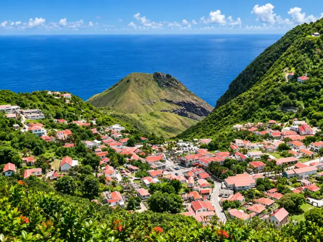 Mountain village with red-roofed homes overlooking the Caribbean Sea in Saba